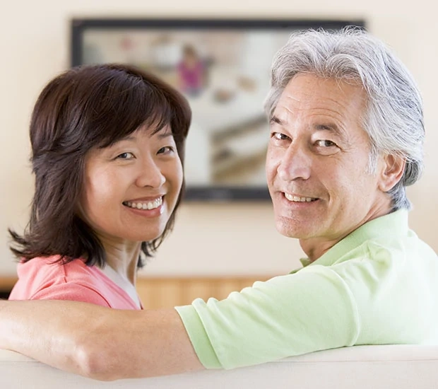 Smiling couple enjoying time together at home